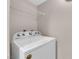 Up close shot of a white washing machine in a laundry room with overhead wire shelving at 45 Maleena Mesa St # 1113, Henderson, NV 89074