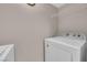 Laundry room featuring bright light and a white washer and dryer with wire shelving at 45 Maleena Mesa St # 1113, Henderson, NV 89074