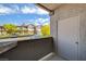 View from the patio overlooking the parking area and neighboring buildings under a bright blue sky at 45 Maleena Mesa St # 1113, Henderson, NV 89074