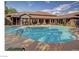 Large community pool with plenty of lounge chairs and a covered patio area for relaxation at 45 Maleena Mesa St # 1113, Henderson, NV 89074