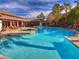 Resort-style pool area features a hot tub, comfortable seating, and inviting umbrellas at 45 Maleena Mesa St # 1113, Henderson, NV 89074