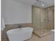 Luxurious bathroom featuring a freestanding tub and a separate glass-enclosed shower at 4525 Dean Martin Dr # 3006, Las Vegas, NV 89103