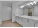 Modern bathroom with double sinks, spacious countertop, and large mirror at 4525 Dean Martin Dr # 3006, Las Vegas, NV 89103