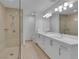 Modern bathroom featuring double sinks, a glass shower, and sleek cabinetry at 4525 Dean Martin Dr # 3006, Las Vegas, NV 89103