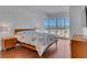 Bright bedroom featuring a large window with city views and hardwood floors at 4525 Dean Martin Dr # 3006, Las Vegas, NV 89103