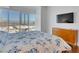 Bedroom featuring a large window with a city view and a stylish wooden dresser at 4525 Dean Martin Dr # 3006, Las Vegas, NV 89103