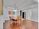 Open dining space adjacent to an entryway featuring hardwood floors, a dining table, and modern decor at 4525 Dean Martin Dr # 3006, Las Vegas, NV 89103