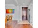 Entryway with hardwood floors leading to a dining area and a dark wood front door at 4525 Dean Martin Dr # 3006, Las Vegas, NV 89103