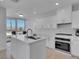 Modern kitchen featuring a breakfast bar with stainless steel appliances and tile floor at 4525 Dean Martin Dr # 3006, Las Vegas, NV 89103