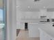 Modern white kitchen featuring sleek cabinets, stainless steel appliances and a wine cooler at 4525 Dean Martin Dr # 3006, Las Vegas, NV 89103