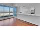 Modern living room with city views from expansive windows, seamlessly connected to kitchen area at 4525 Dean Martin Dr # 3006, Las Vegas, NV 89103