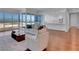 Open concept living space with floor-to-ceiling windows offering city views, connected to kitchen at 4525 Dean Martin Dr # 3006, Las Vegas, NV 89103