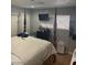 Comfortable bedroom featuring a four poster bed, closet and a window allowing natural light at 4825 E Monroe Ave, Las Vegas, NV 89110