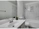 Clean bathroom featuring updated fixtures and a tiled shower-tub combination at 5032 S Rainbow Blvd # 206, Las Vegas, NV 89118