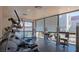 Well-equipped gym with natural light, offering various exercise machines and a view of the outside at 5032 S Rainbow Blvd # 206, Las Vegas, NV 89118