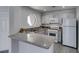 Well-maintained kitchen featuring ample counter space and modern white appliances at 5032 S Rainbow Blvd # 206, Las Vegas, NV 89118