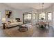 Bright living room featuring a fireplace, neutral decor, and access to a private patio at 5032 S Rainbow Blvd # 206, Las Vegas, NV 89118