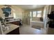 Large primary bathroom with a soaking tub, vanity, and tiled floors at 5615 Oak Bend Dr, Las Vegas, NV 89135