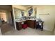 Spacious bathroom vanity with tiled backsplash, dark wood cabinets, and ample counter space at 5615 Oak Bend Dr, Las Vegas, NV 89135