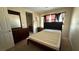 Bedroom featuring ample natural light, a dresser, and an ensuite bathroom at 5615 Oak Bend Dr, Las Vegas, NV 89135