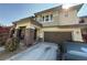 Charming two-story home boasting stone accents, a covered porch, and a convenient two-car garage at 5615 Oak Bend Dr, Las Vegas, NV 89135