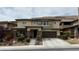 Beautiful two-story home featuring desert landscaping, a large front porch, and a two-car garage at 5615 Oak Bend Dr, Las Vegas, NV 89135