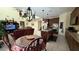 Charming kitchen area with stainless appliances, dark cabinetry and adjacent dining space at 5615 Oak Bend Dr, Las Vegas, NV 89135