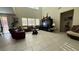 Bright living room with high ceilings, tile floors, and large windows offering ample natural light at 5615 Oak Bend Dr, Las Vegas, NV 89135