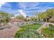 Private backyard featuring lush garden, lawn and pool areas, offering a serene outdoor space at 5892 Castleberry Peak Ave, Las Vegas, NV 89131