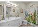 Stylish bathroom featuring a double sink vanity and colorful shower curtain at 5892 Castleberry Peak Ave, Las Vegas, NV 89131