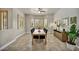Inviting dining room with wood floors and natural light from shuttered windows at 5892 Castleberry Peak Ave, Las Vegas, NV 89131