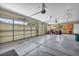 Spacious three car garage with ample storage space and overhead lighting at 5892 Castleberry Peak Ave, Las Vegas, NV 89131
