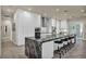 Bright kitchen with sleek white cabinetry, black marble island, and stainless steel appliances at 5892 Castleberry Peak Ave, Las Vegas, NV 89131