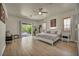 Light-filled primary bedroom with sliding door access to the backyard at 5892 Castleberry Peak Ave, Las Vegas, NV 89131