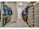 Spacious walk-in closet featuring custom shelving and rod system at 5892 Castleberry Peak Ave, Las Vegas, NV 89131