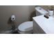 View of a toilet and sink in a modest bathroom at 609 Marcella Ave, North Las Vegas, NV 89030