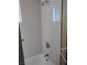 A well-lit, tiled shower with a window at 609 Marcella Ave, North Las Vegas, NV 89030
