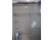 Bathroom featuring a shower with frosted glass and tiled walls at 609 Marcella Ave, North Las Vegas, NV 89030
