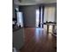 Bright dining area with sliding glass doors and wood-look flooring at 609 Marcella Ave, North Las Vegas, NV 89030