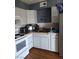 Well-lit kitchen with ample cabinet space and modern appliances at 609 Marcella Ave, North Las Vegas, NV 89030