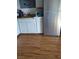 Clean kitchen featuring modern stainless steel refrigerator and bright white cabinets at 609 Marcella Ave, North Las Vegas, NV 89030