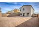 Open backyard view of an empty lot with privacy walls and desert landscaping potential at 6164 Violet Falls St # 44, North Las Vegas, NV 89081