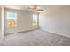 Bedroom with carpeted floors, neutral paint, and natural light from two windows at 6164 Violet Falls St # 44, North Las Vegas, NV 89081