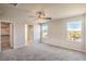 Bedroom features carpet, natural light, and access to closet and bathroom at 6164 Violet Falls St # 44, North Las Vegas, NV 89081