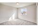 Comfortable bedroom featuring soft carpeting and a bright window at 6164 Violet Falls St # 44, North Las Vegas, NV 89081