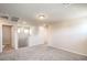 Large bonus room with carpeted floors and stairway access at 6164 Violet Falls St # 44, North Las Vegas, NV 89081