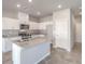 Well-lit kitchen with white cabinetry, granite countertops, and stainless steel appliances at 6164 Violet Falls St # 44, North Las Vegas, NV 89081