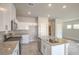 Modern kitchen featuring stainless appliances, island with sink and granite countertops at 6164 Violet Falls St # 44, North Las Vegas, NV 89081