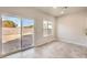 Bright living area with tile floor, large sliding glass door and natural light at 6164 Violet Falls St # 44, North Las Vegas, NV 89081