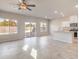 Open concept living space with a kitchen and lots of natural light from large windows at 6164 Violet Falls St # 44, North Las Vegas, NV 89081